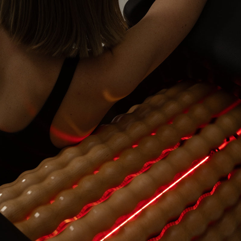 Close-up of Roll Therapy infrared heat rollers during lymphatic drainage massage
